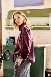 chemise col montant plume